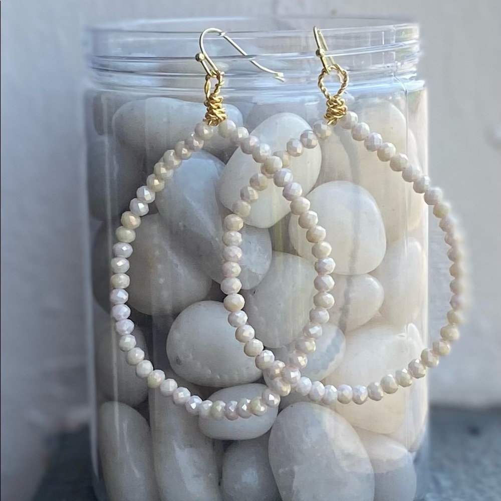 Cream hoop crystal earrings.